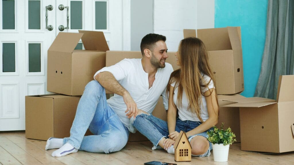 couple in new home, surrounded by boxes