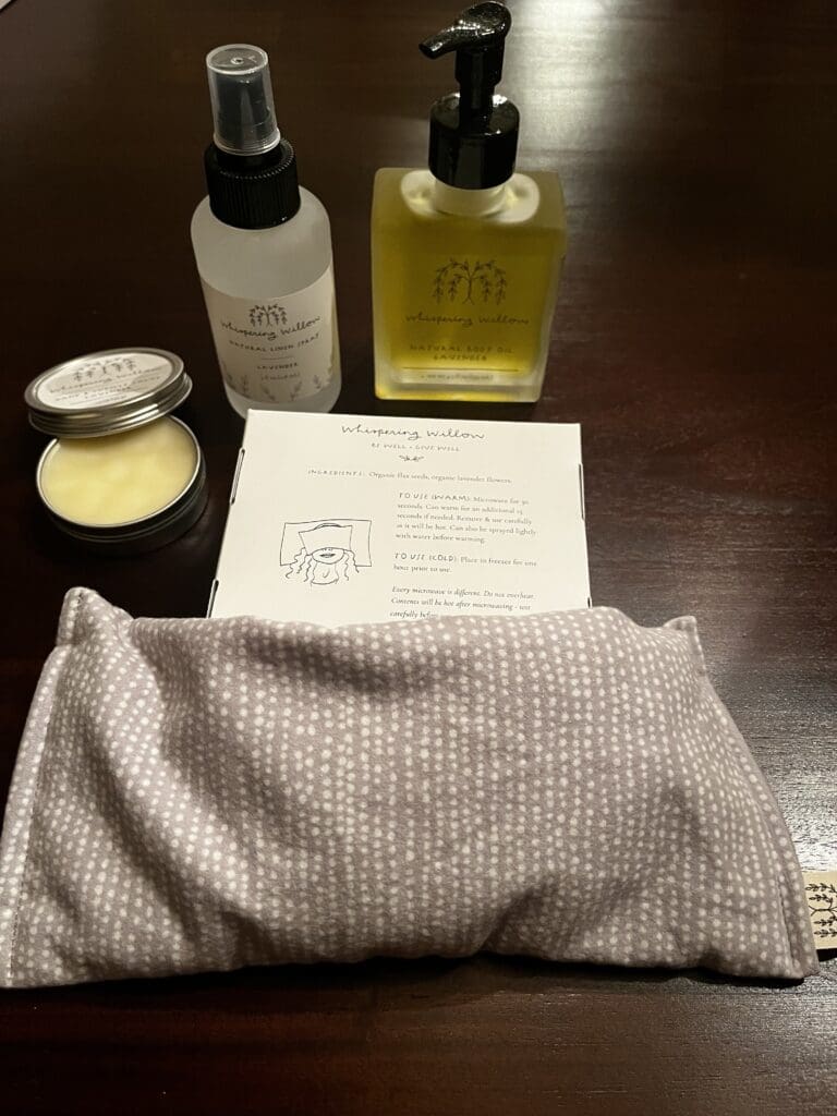 Unboxed Whispering Willow Tranquility Box items: hand salve, pillow spray, body oil, and eye pillow.