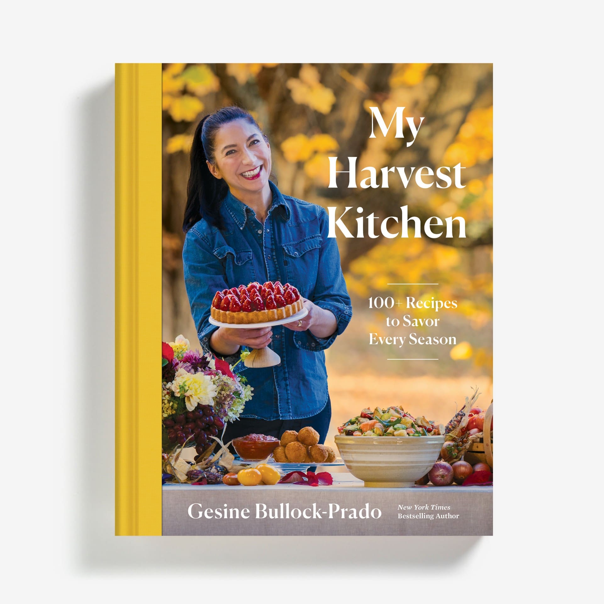 Book cover for My Harvest Kitchen by Gesine Bullock-Prado, featuring Gisine holding. beautiful dessert tart and smiling widely.