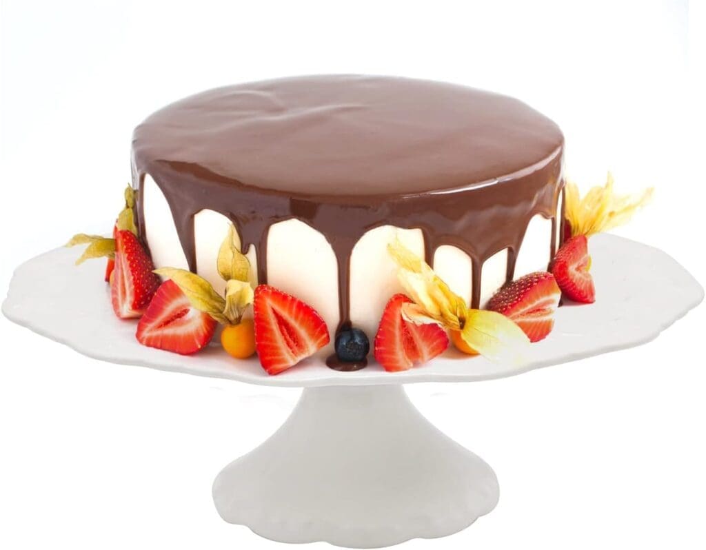 White cake stand with white cake and marble glaze for Chanel party