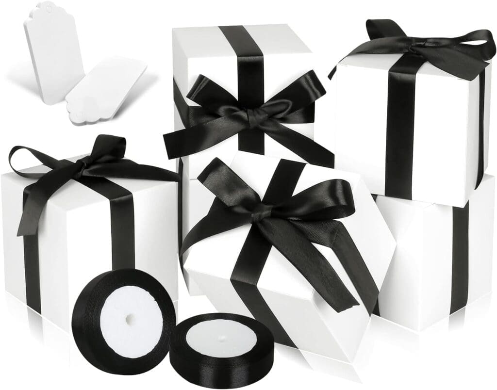 White boxes tied with black ribbons for Chanel party